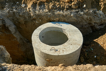 Fototapeta premium Sewer well on the construction site, sewerage, communication,