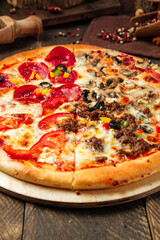 Four seasons pizza with different toppings