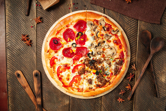 Four seasons pizza with different toppings