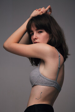 Woman with 	constellation tattoo on ribs