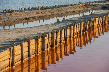 Salt evaporation lake shores. An industrial salt plant produces - natural sea salt.