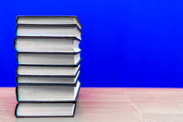 stack of old books, grungy background, free copy space blue background