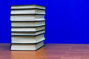 stack of old books, grungy background, free copy space blue background