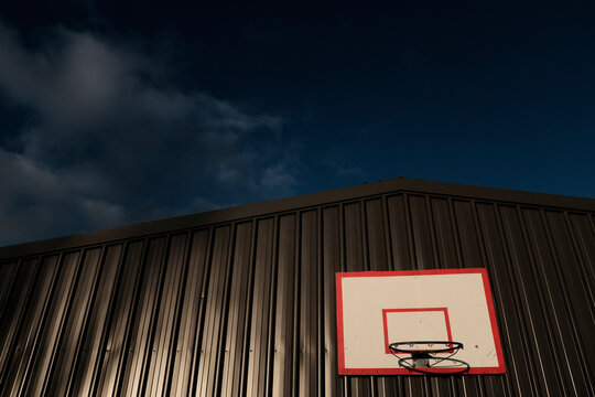 Basketball backboard on shed