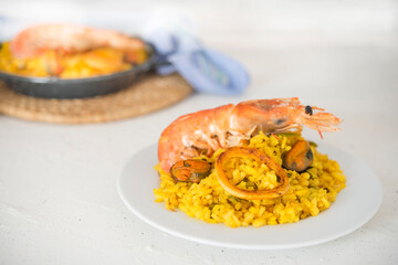 Paella typical spanish food in granite background