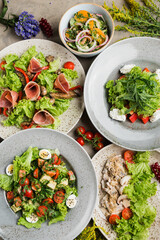 many beautiful dishes and salads for the buffet