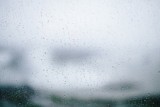 small raindrops on a window looking outside