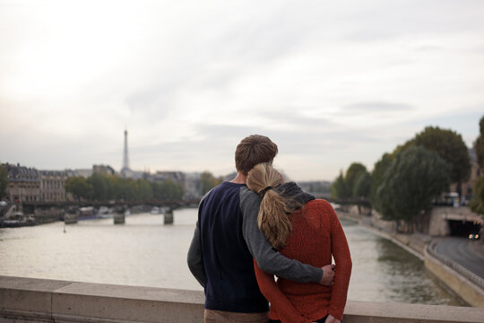 Young couple on a bridge in Paris