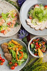 many beautiful dishes and salads for the buffet