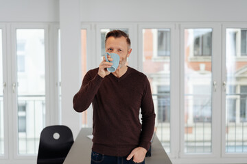 Businessman taking a break enjoying a coffee