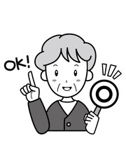 OKサインを持ったおばあさん
