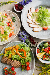 many beautiful dishes and salads for the buffet