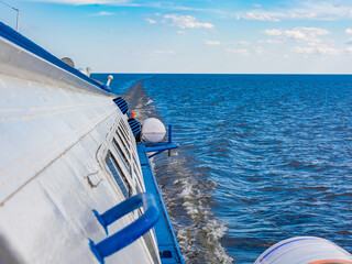 Hydrofoil meteor or comet on Lake Onega. View from the window of a moving ship in the trail on the...