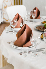 table setting with cutlery and dishes in the restaurant