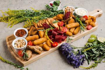 assortment of different snacks and nuggets for beer