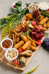assortment of different snacks and nuggets for beer