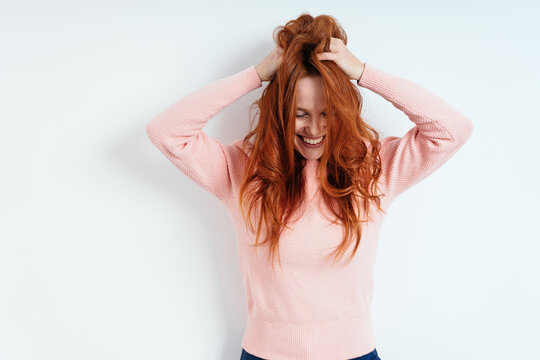 Laughing Young Woman Having A Bad Hair Day