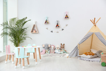 Cute children's room interior with teepee tent and little table