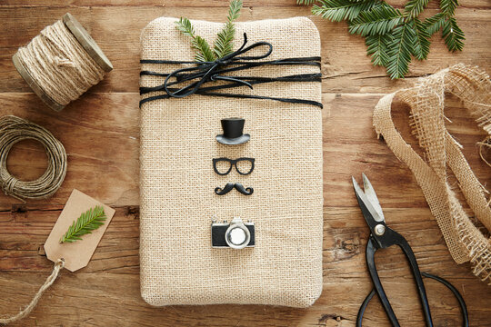 Still life of hipster present with homemade wrapping paper