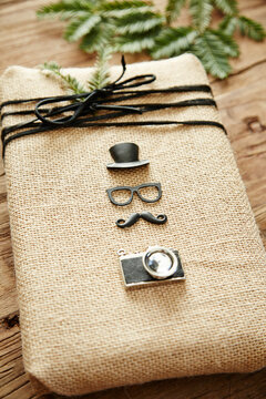 Hipster Christmas gift wrapped in burlap