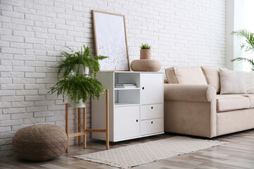 Modern room interior with stylish white cabinet