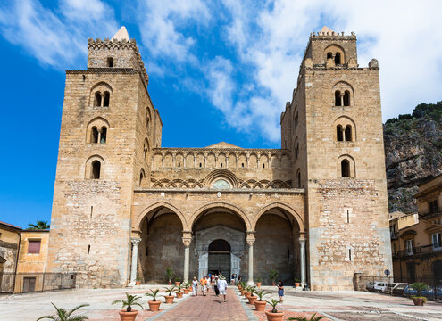 CEFALU, ITALY - JUNE 25, 2011: entrance in Duomo di Cefalu in Sicily. Cathedral - Basilica of Cefalu was erected in 1131 in the Norman architectural style