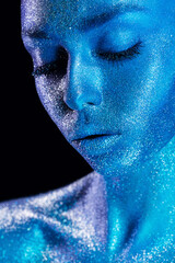 cute magic woman in blue body art with glitters