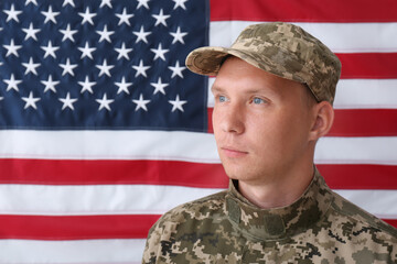 Soldier in uniform against United states of America flag