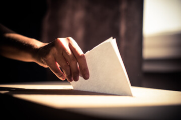 Conceptual image of a person voting during elections - obrazy, fototapety, plakaty