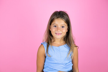 Young beautiful child girl over isolated pink background smiling and looking at the camera