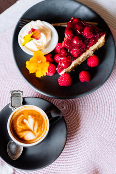 berry cheesecake with cherries and raspberries, and piccolo latt