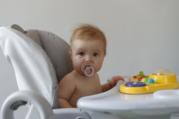 Baby girl in high chair
