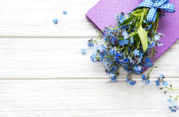 Forget-me-not flowers and notebook