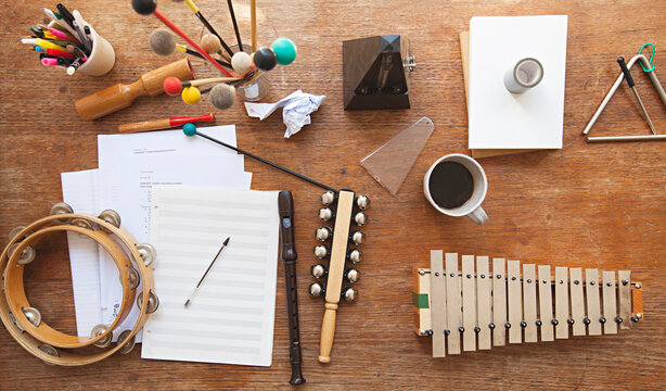 Overhead view of a music teacher's desk with random instruments