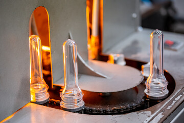 Preforms for making PET plastic bottles. Blank for production of containers for milk or beer. Line factory industry equipment