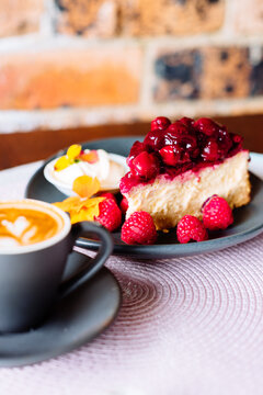 berry cheesecake with cherries and raspberries