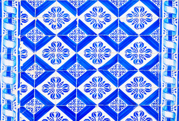 Detail of the traditional tiles from facade of old house. Decorative tiles.Portuguese traditional tiles. Floral ornament.