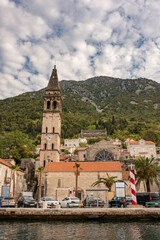 Perast historic town at Kotor bay. Ancient city in Montenegro. Chapel with a bell tower in center of Perast.