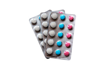 Multi-colored tablets in a blister. Isolate on a white background.