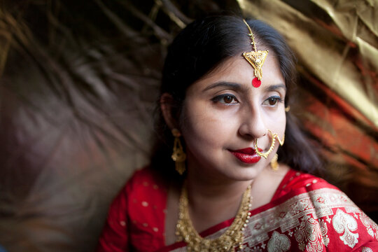 Young Indian woman wearing traditional ornaments with traditional dress