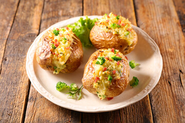 baked potato with cream and vegetable