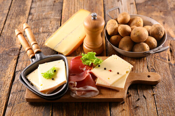 raclette cheese with ham and potato