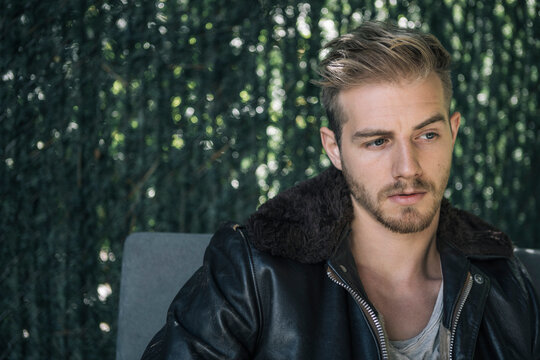Portrait of Man in Leather Bomber Jacket with Shearling Collar