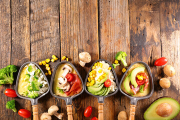 set of raclette spoon with vegetables