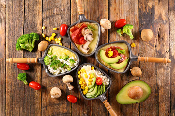 set of raclette spoon with vegetables