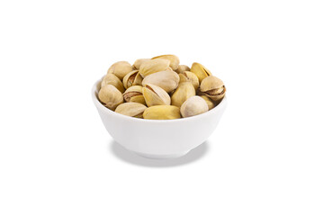 Pistachios in white porcelain bowl. Close-up. Isolated on white background.