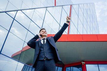 Handsome Businessman full of Happiness enjoying Great news about his business Deal Outdoor. talking...