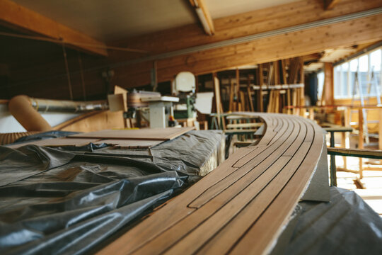 Shipbuilding factory. High-skilled work with wooden manufactures