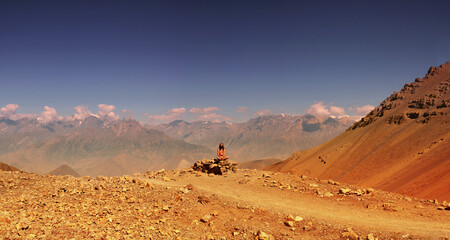 naked wild man meditating in mountains