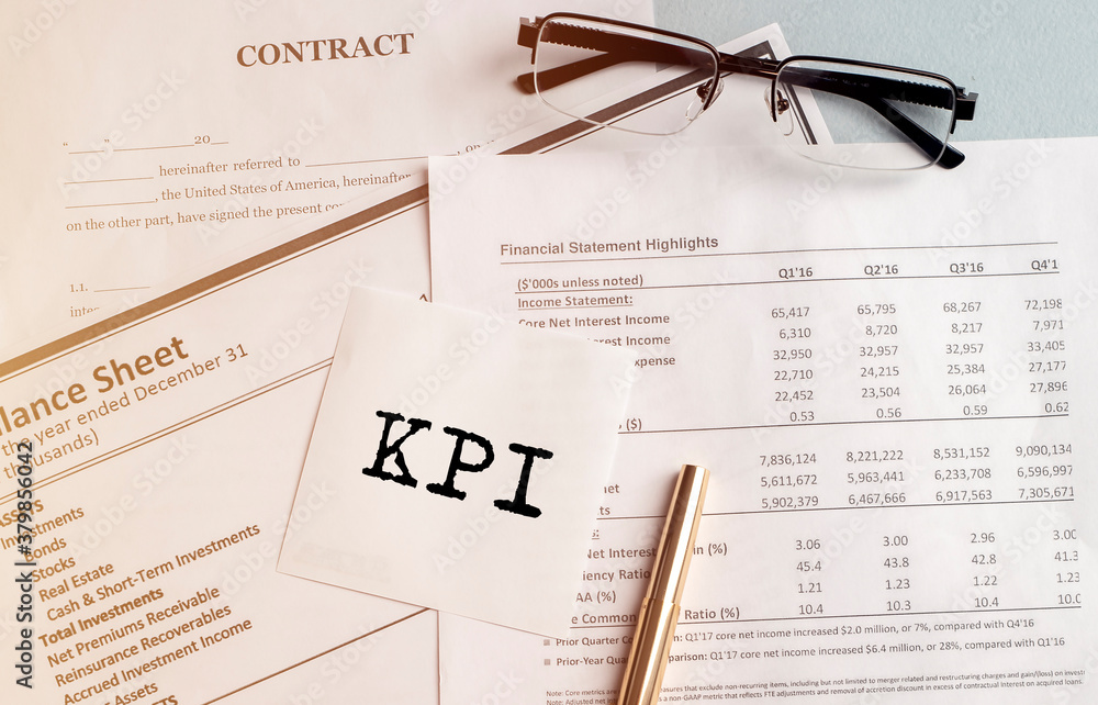 Poster kpi key performance indicator written on a paper note on financial documents